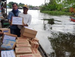 Distribusikan Bantuan dengan Perahu Kelotok